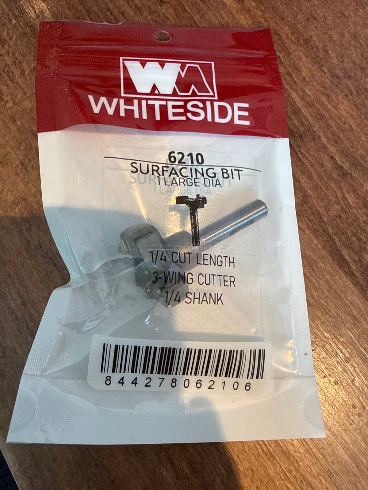 A Whiteside 6210 surfacing bit in its retail bag, labelled with a quarter-inch shank