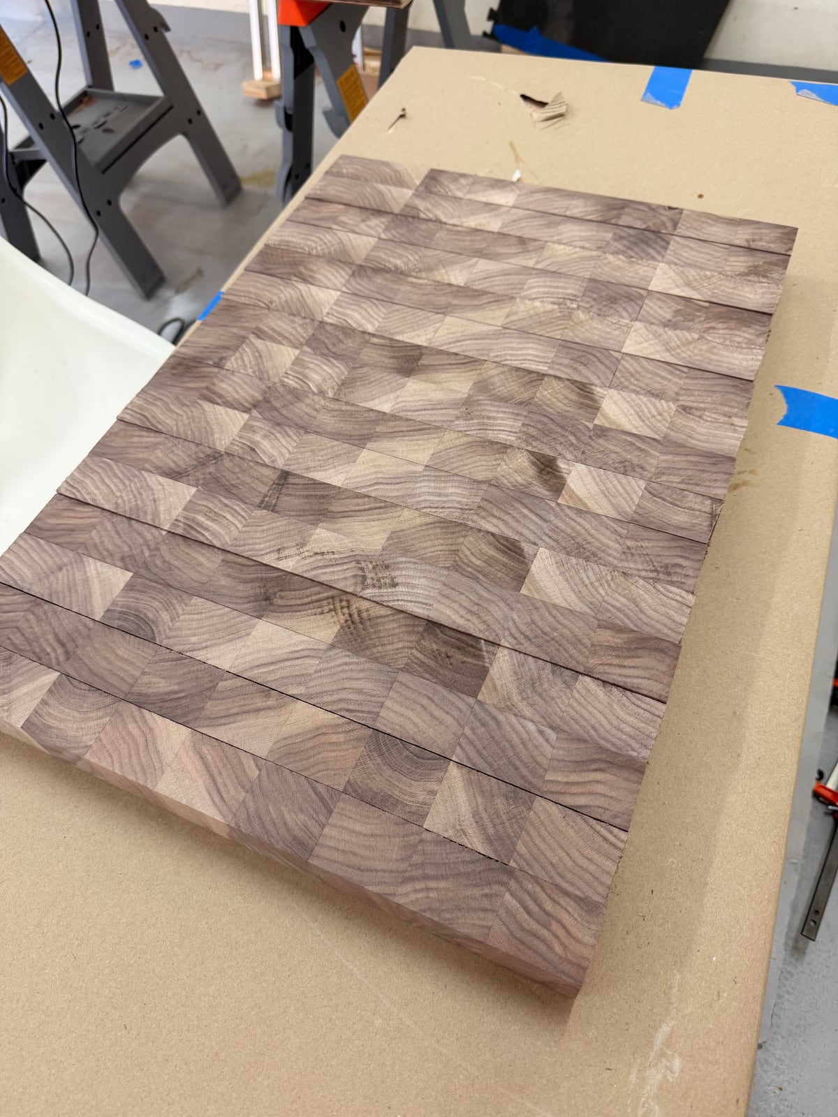 End grain walnut pieces arranged in a different pattern on the bench