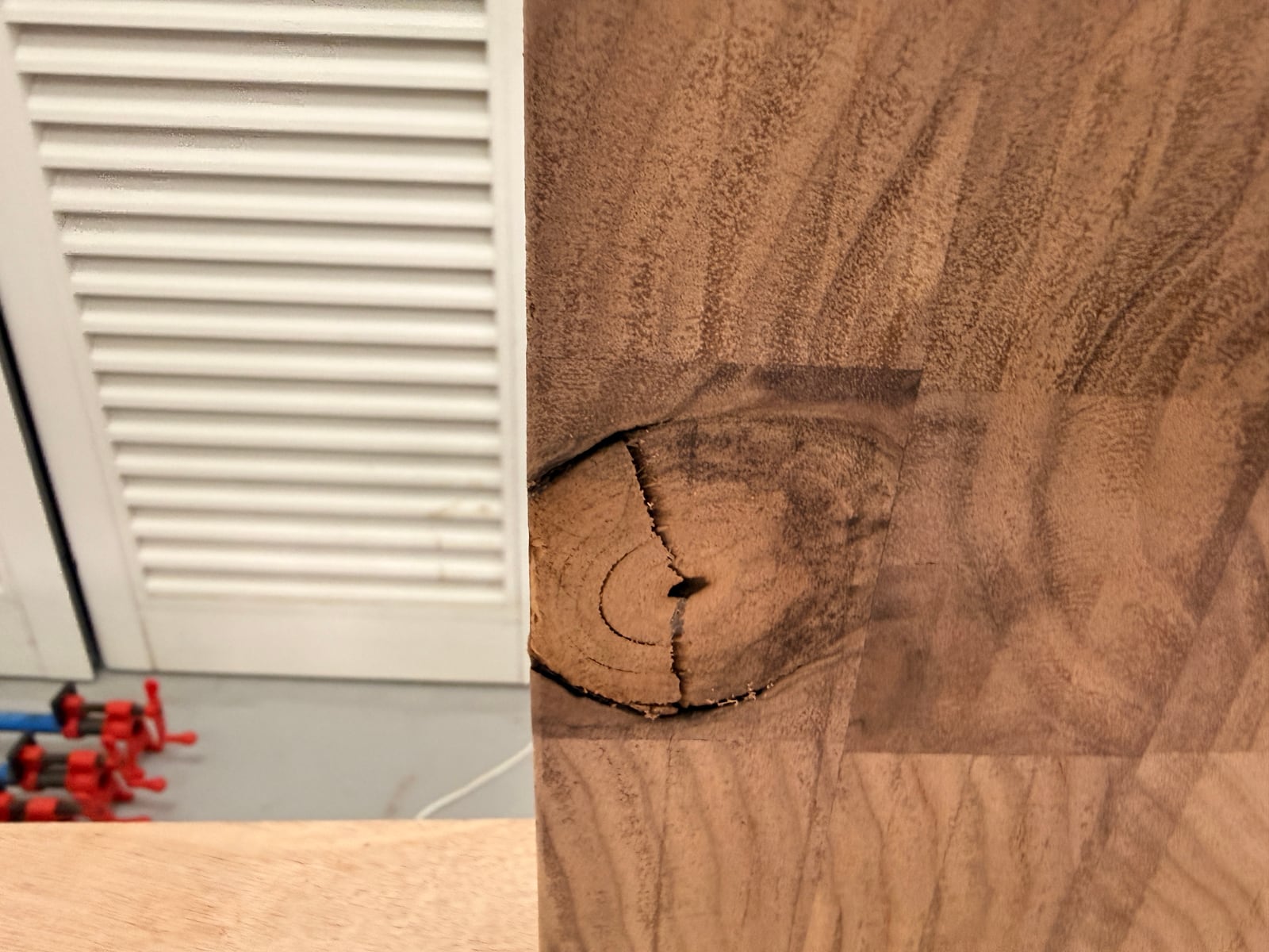 A cracked knot at the edge of the end grain board