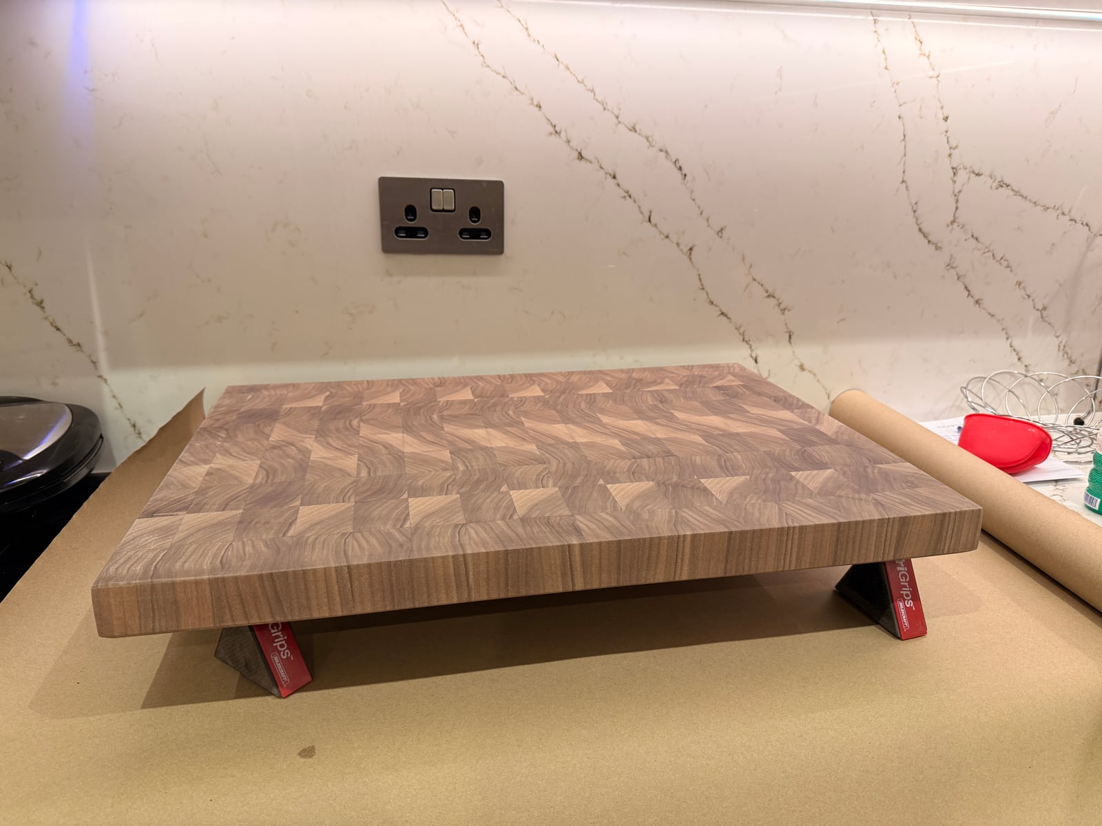 The board raised on small painter's pyramids on a kitchen counter, freshly oiled