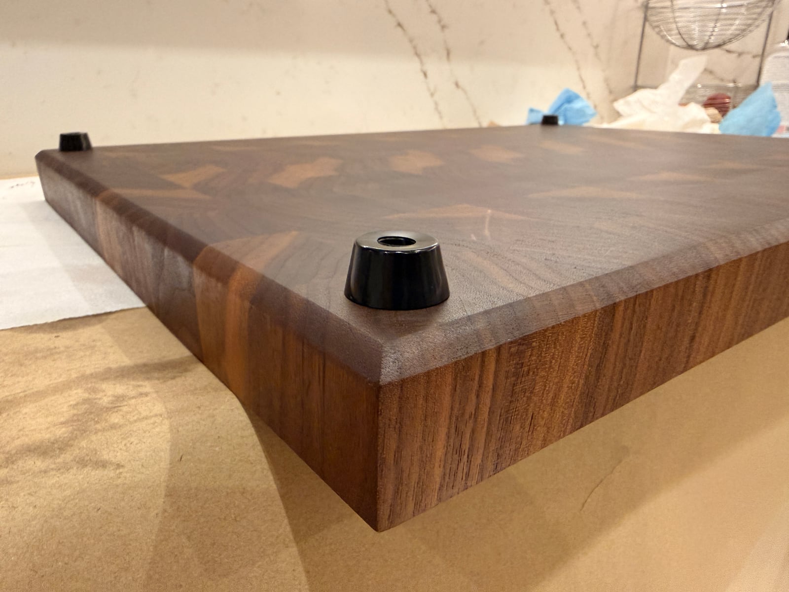 The board upside down, showing black rubber feet fitted at the corners