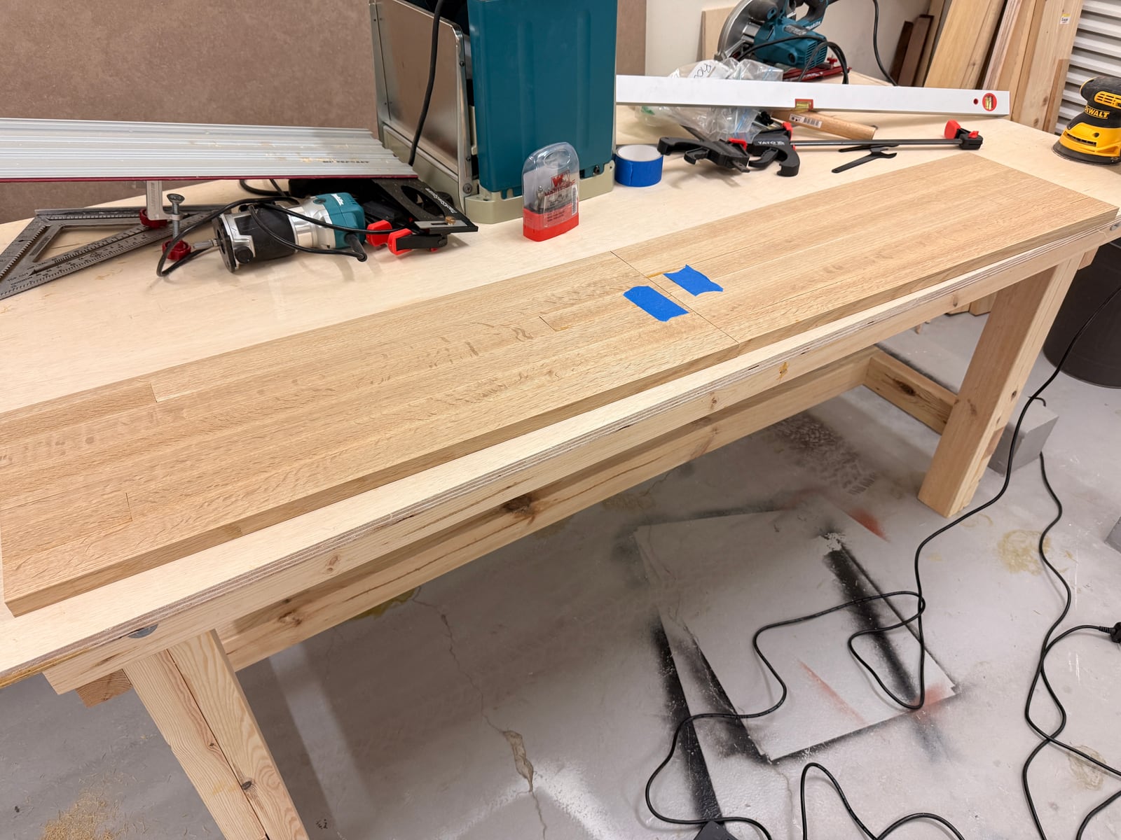 The oak strips dry fitted into a long panel on the workbench