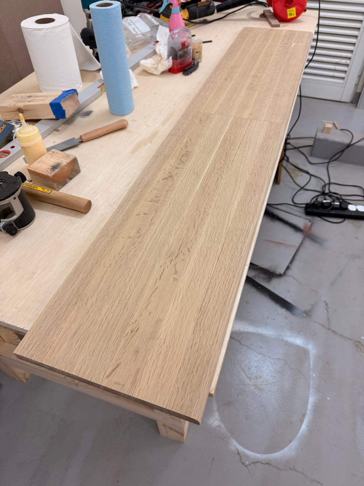 The oak panel sanded flat and clean on the workbench