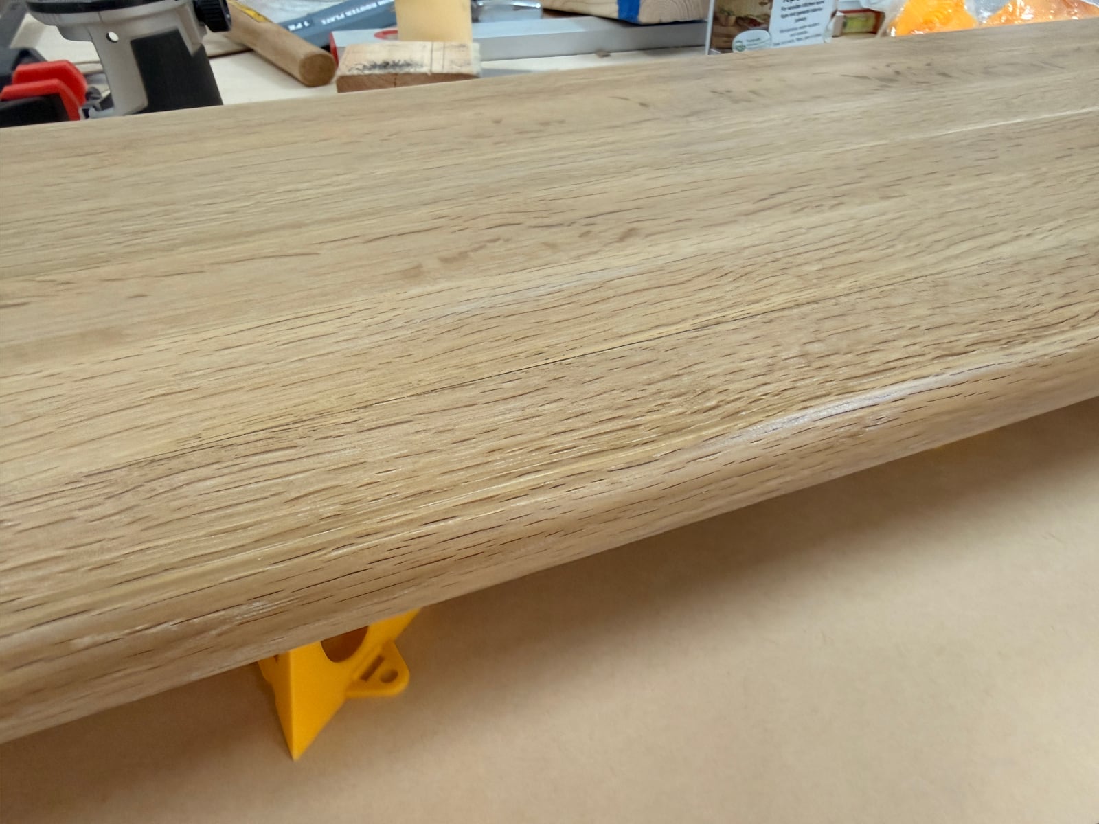 Close-up of the rounded-over edge of the oak panel