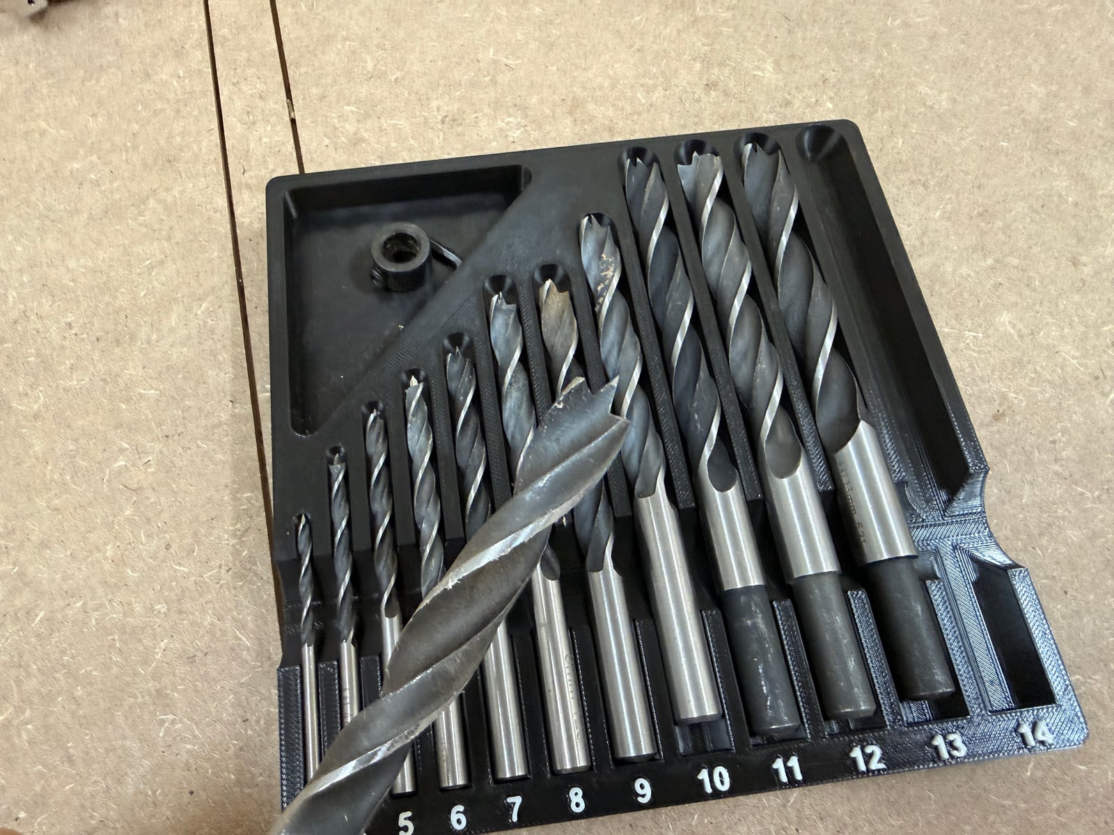 A metric brad point set, 4-14mm. The centre spur on each tip is the whole point of the design -- it bites first and stops the bit skating off the mark.