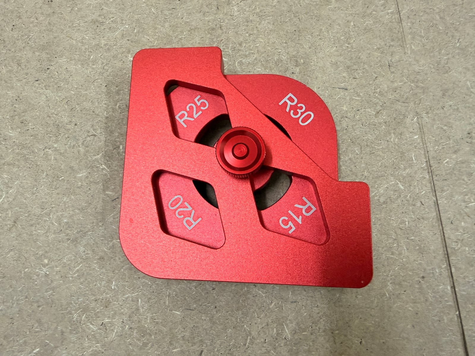 A corner radius template with four radii (R15, R20, R25, R30) selectable by rotating the body.