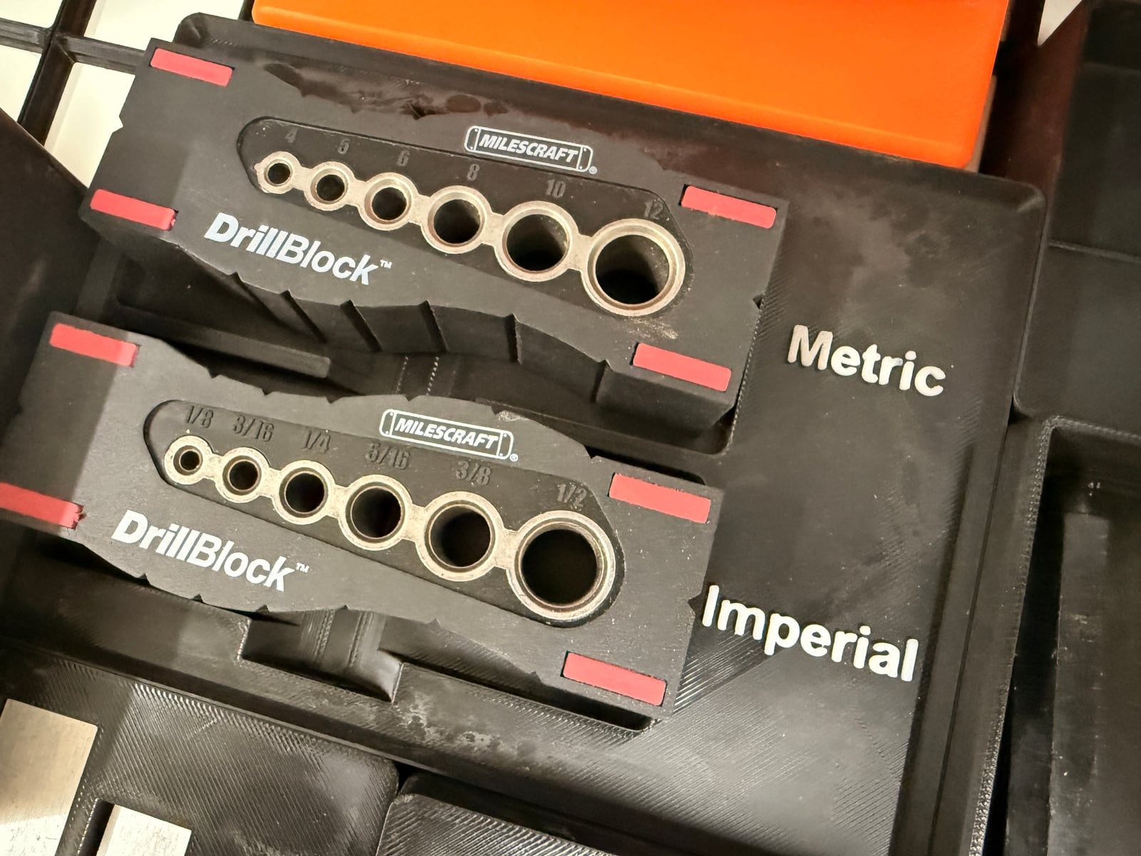 Metric and imperial drill guide blocks, each with hardened steel bushings in a range of sizes.