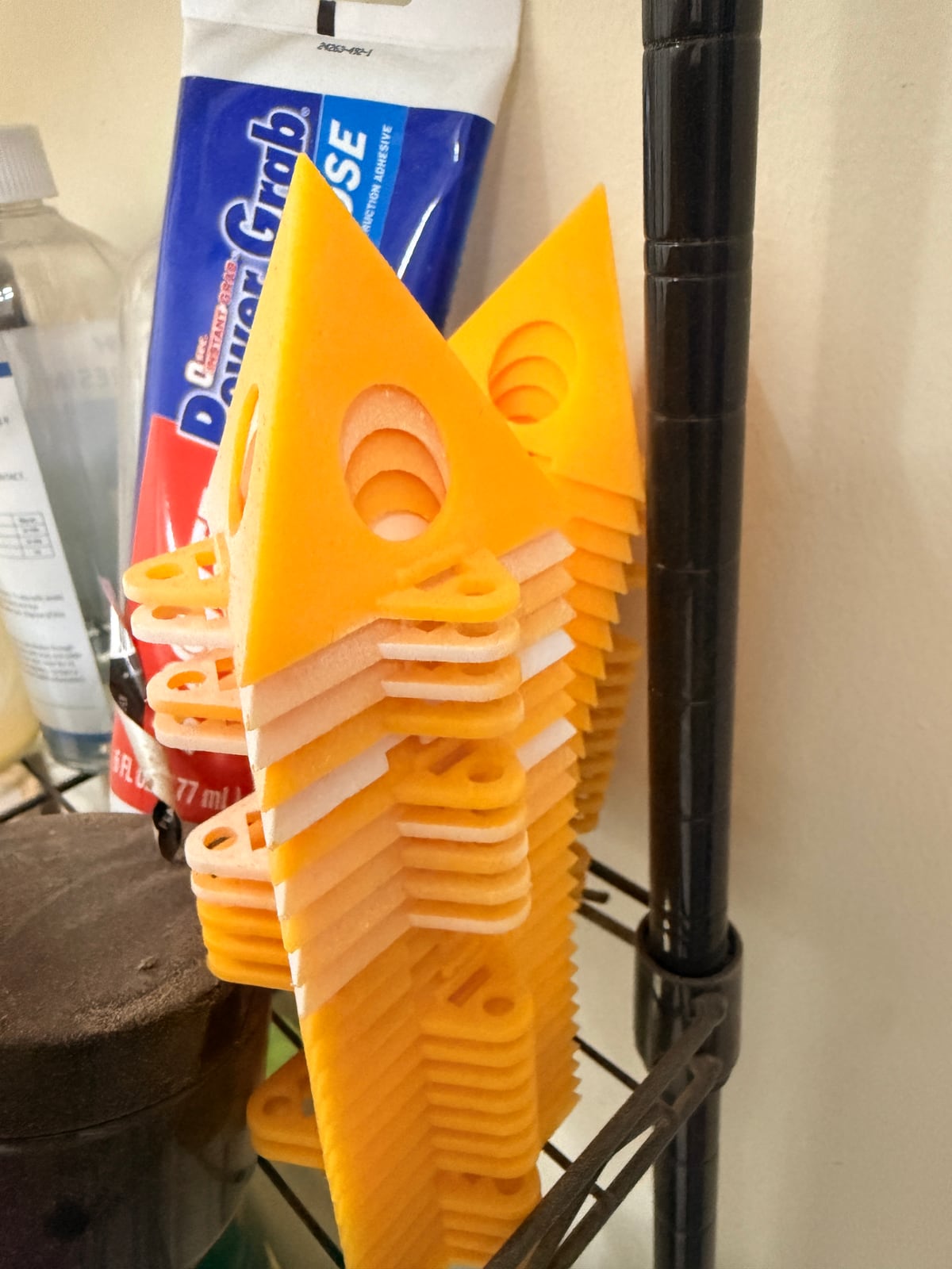 A stack of painter's pyramids -- moulded triangles with a sharp raised point at the centre.