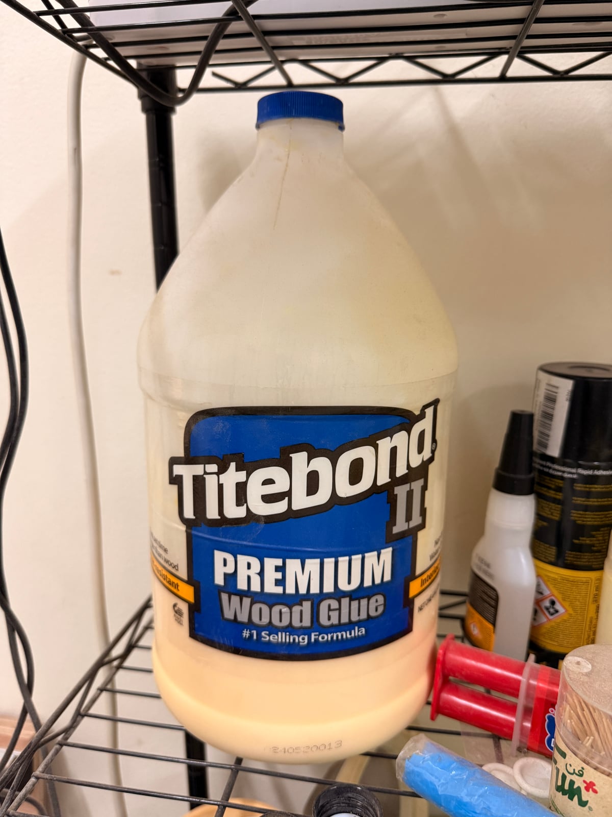 A gallon of Titebond II. Buying PVA by the gallon and decanting into a small bottle costs a fraction of replacing squeeze bottles.