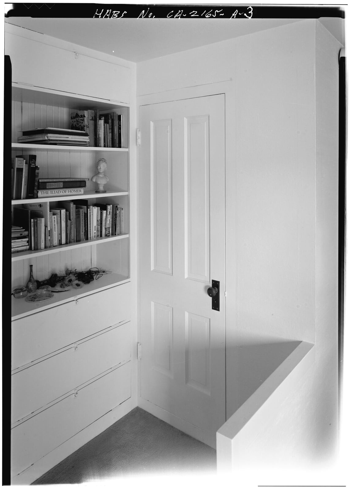 A built-in bookshelf with flush trim, from a Historic American Buildings Survey record