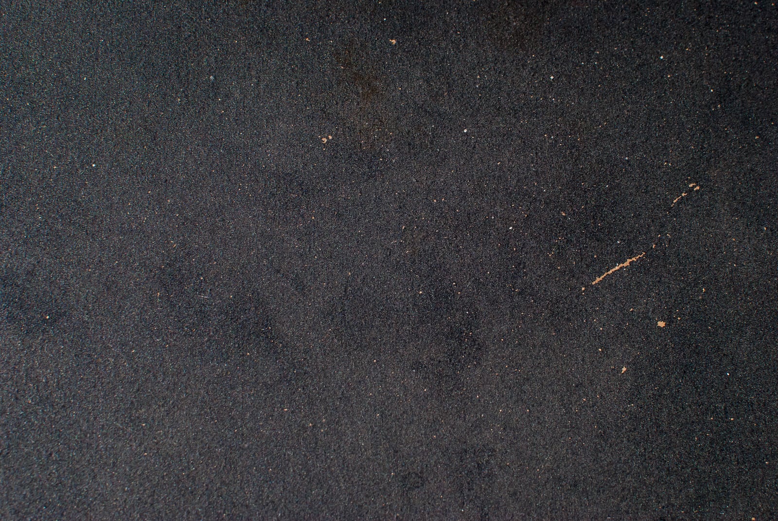 Close-up of gritty sandpaper texture