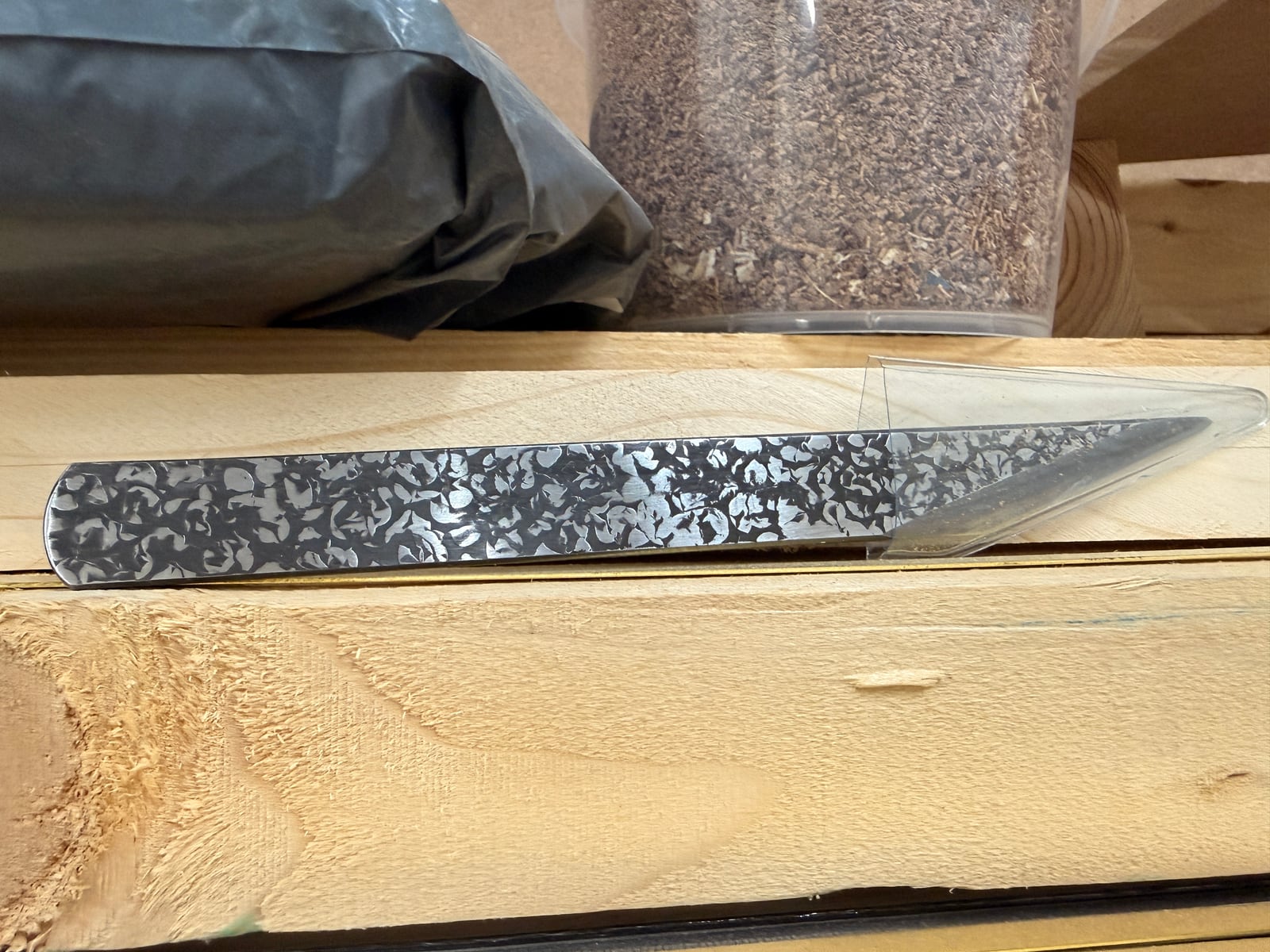 A Japanese kiridashi marking knife. The single bevel is the feature: the flat face registers against a rule or a square, so the cut lands exactly on the line.