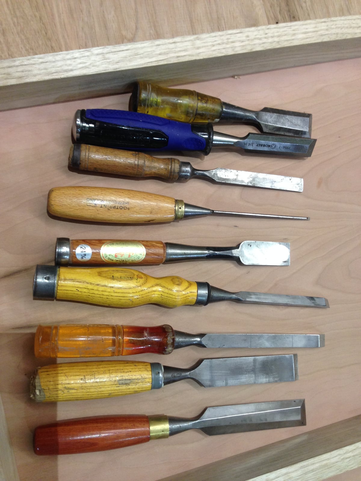 A set of bench chisels in ascending width. Which one you reach for is usually decided by the joint, not by preference.