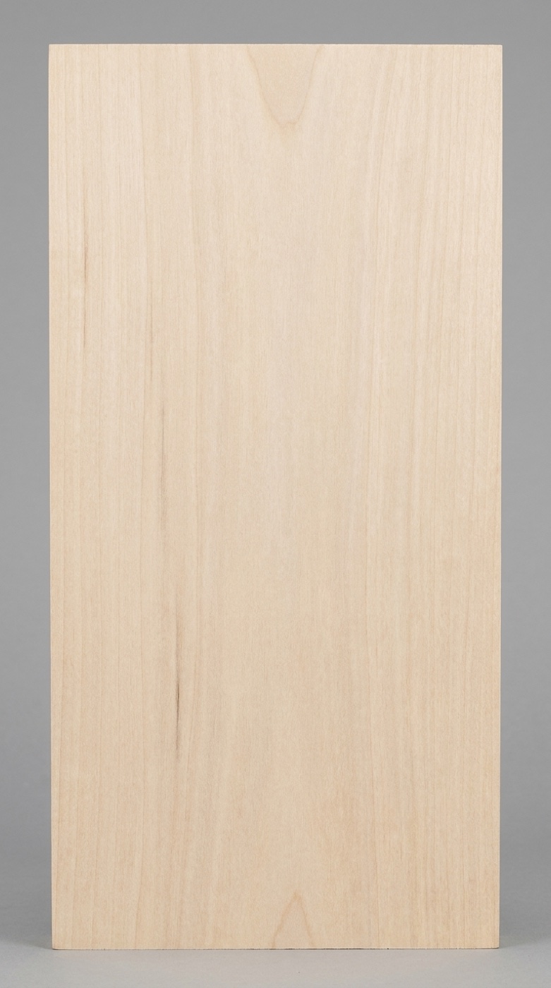 A board of basswood -- pale, even, and nearly featureless, which is exactly what carvers want from it