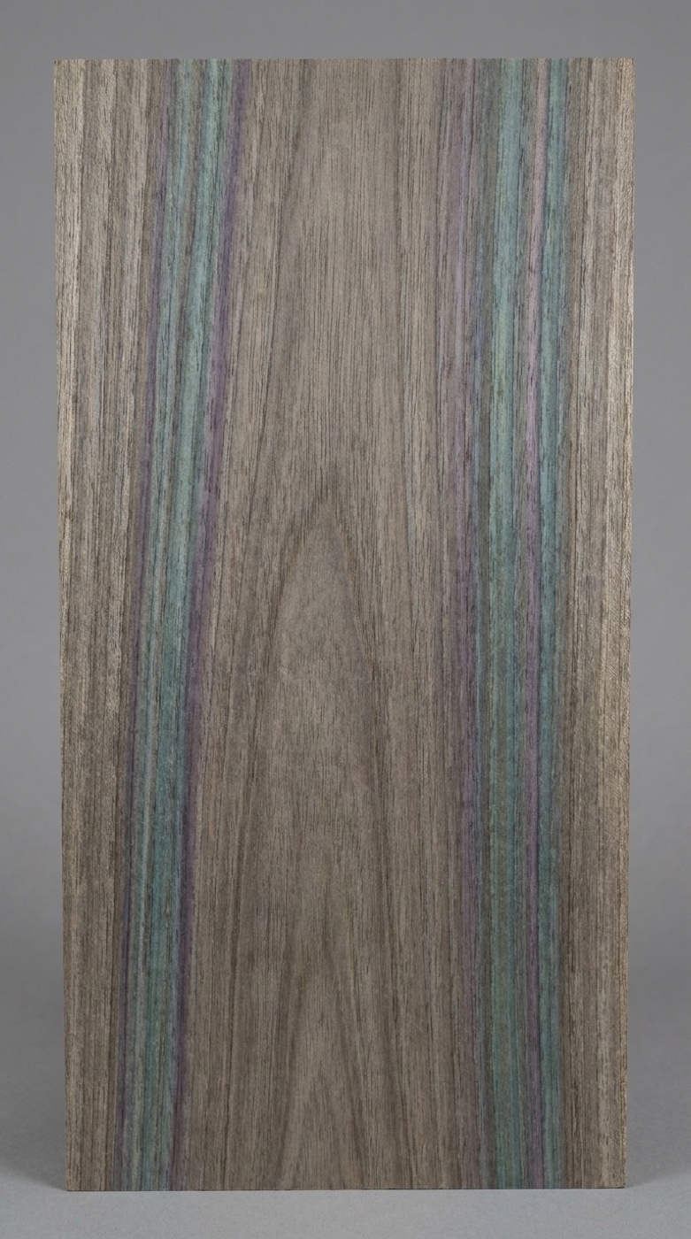 A board of blue mahoe -- gray-brown with the metallic blue-green and purple streaking unique to the species