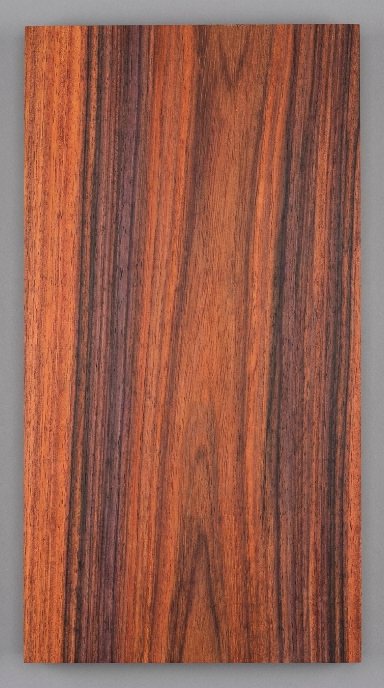 A board of Bolivian Rosewood (Morado/Pau Ferro) -- reddish-violet brown with darker black streaking