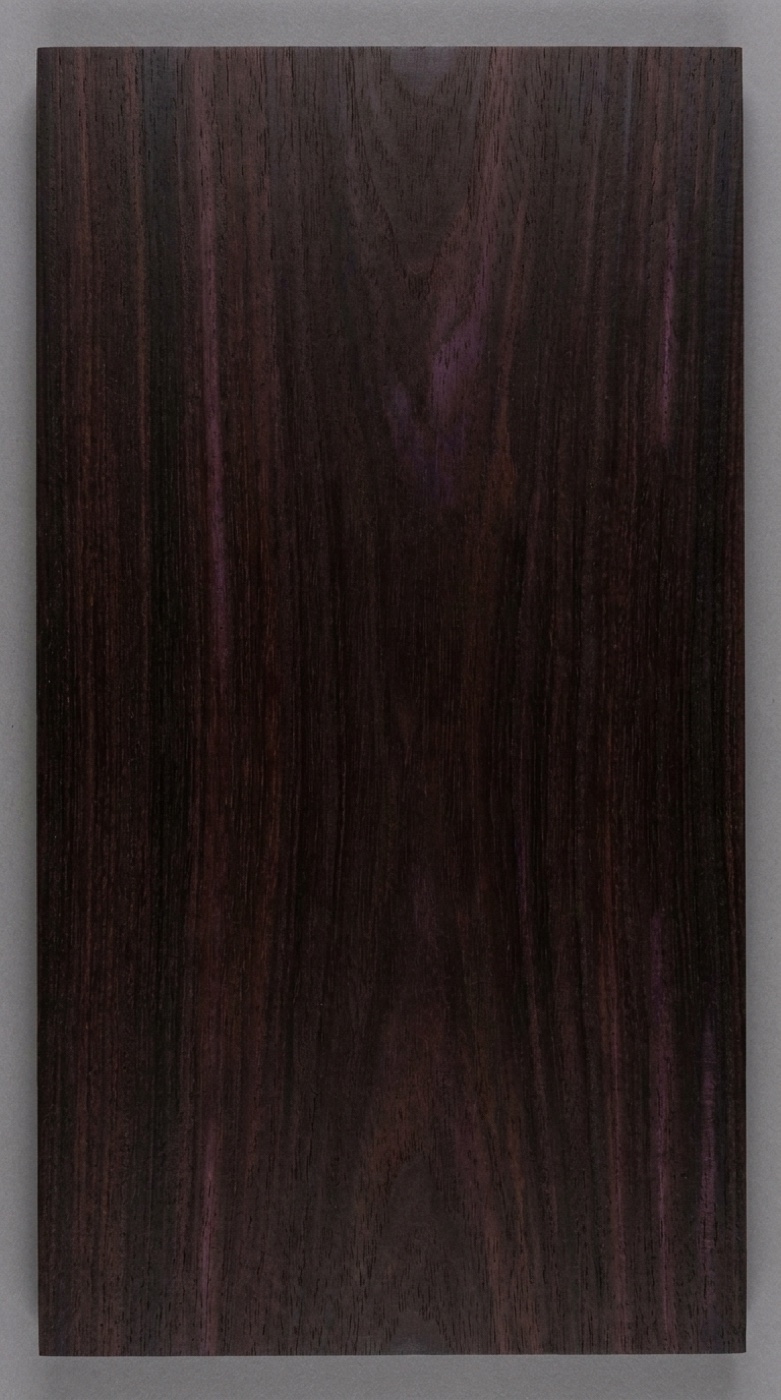 A board showing the very dark reddish-brown to near-black heartwood sold as Brazilian Ebony