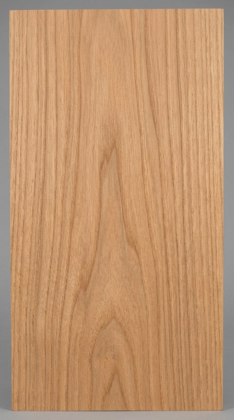 A board of butternut -- walnut's open grain structure in a light golden tan