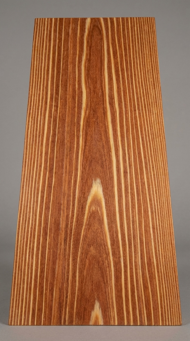 A board of Caribbean Heart Pine -- reddish-brown heartwood with pronounced growth-ring banding