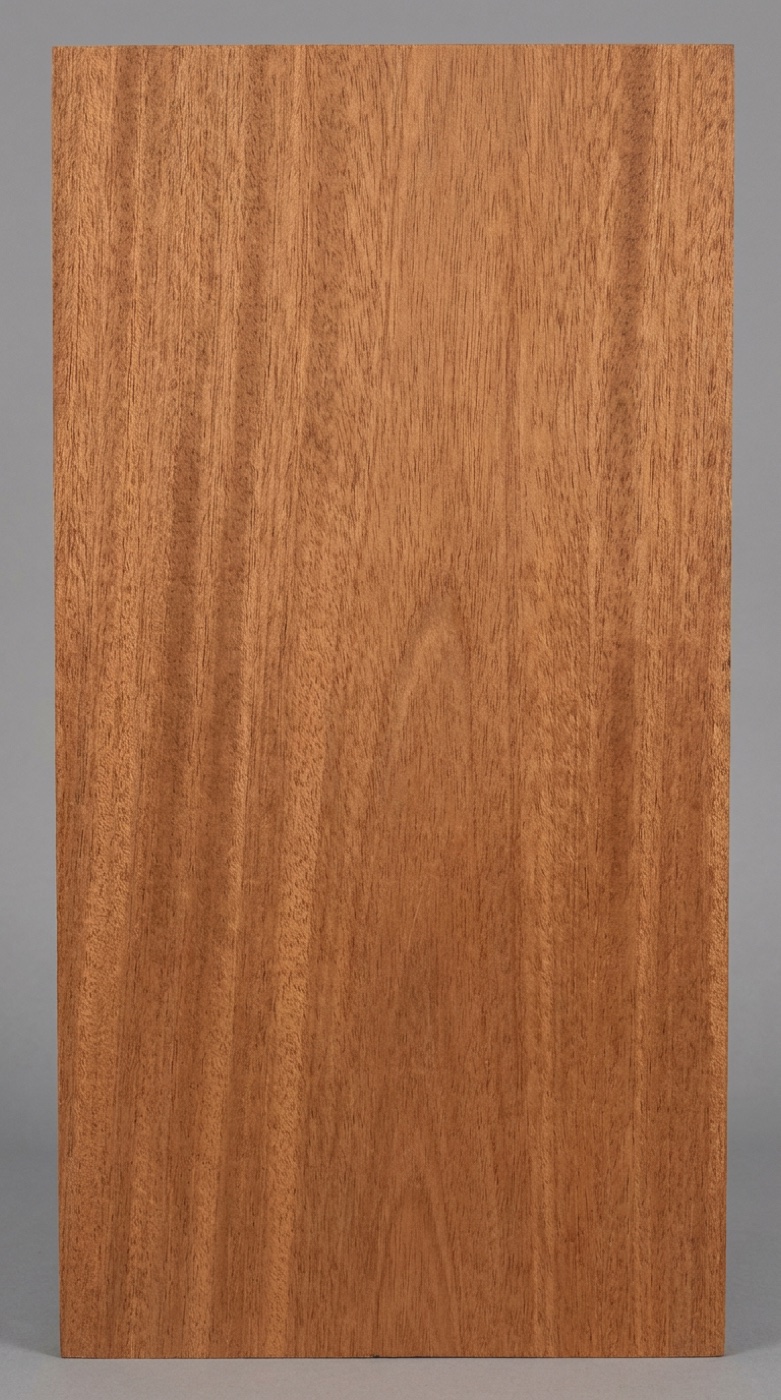A board of Honduran mahogany -- the deep reddish brown it ages into, with a subtle ribbon stripe