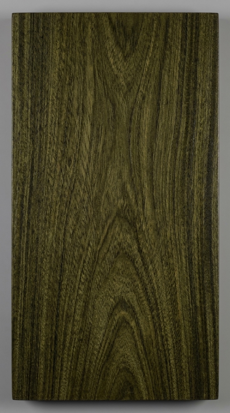 A board of lignum vitae -- dark olive-green, oily, and the densest wood ever traded commercially