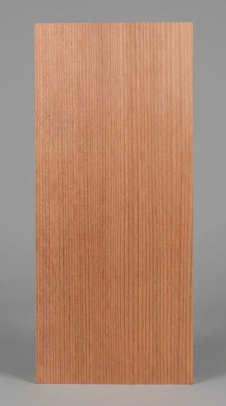 A board of redwood -- pinkish to reddish brown, straight grained and coarse textured