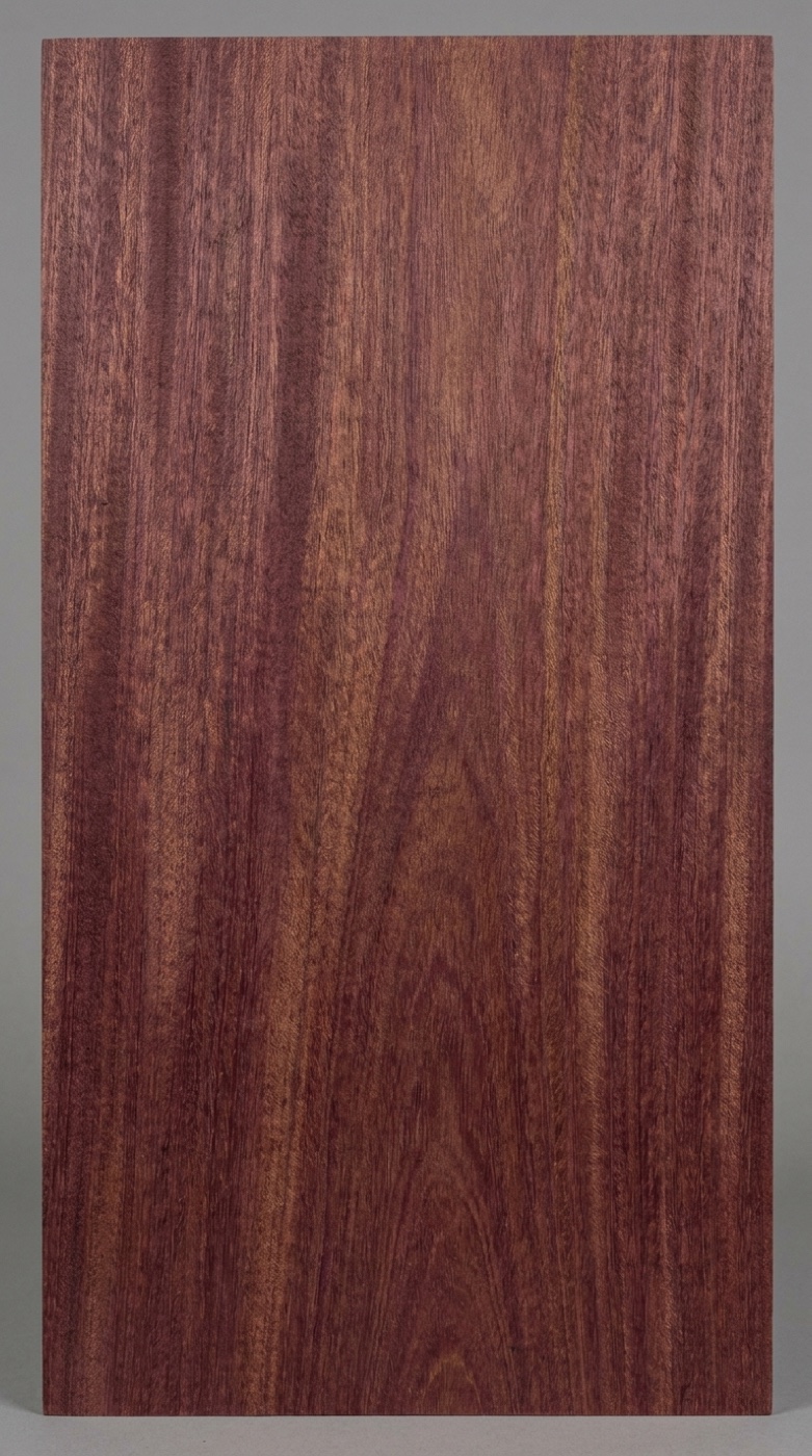 A board of Santos Mahogany -- golden brown to purplish red with a subtle striped figure